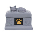 Sleeping cat pet memorial urn with gold paw detail