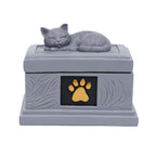 Sleeping cat pet memorial urn with gold paw detail