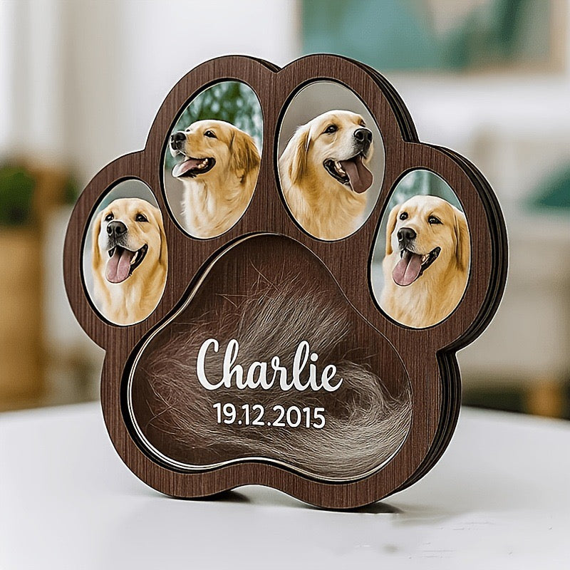 Brown paw-shaped memorial shadow box showing example dog photos and name-and-date engraving.