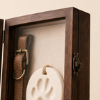 Close-up of walnut pet memorial shadow box frame, latch and linen interior