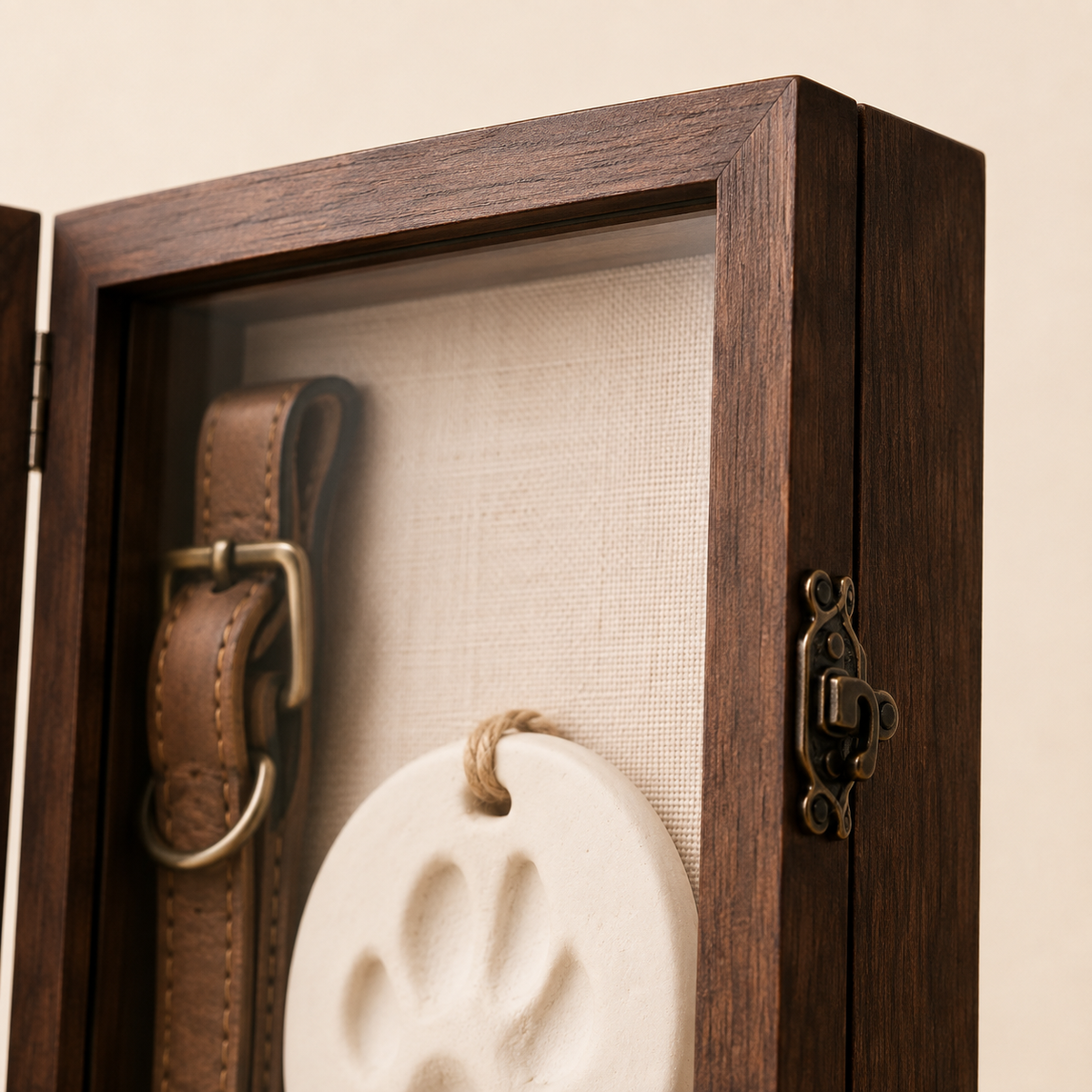 Close-up of walnut pet memorial shadow box frame, latch and linen interior